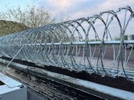 Razor wire around the industrial yard